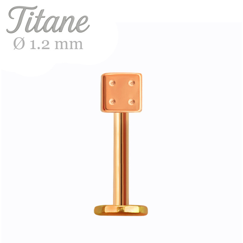 Labret en titane or rose avec dé stylisé
